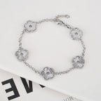 Hollow Metal Double sided Hollow Jewelry Set Sparkling Hot Selling Plum Blossom Jewelry Set Creative New Design For Women Clover